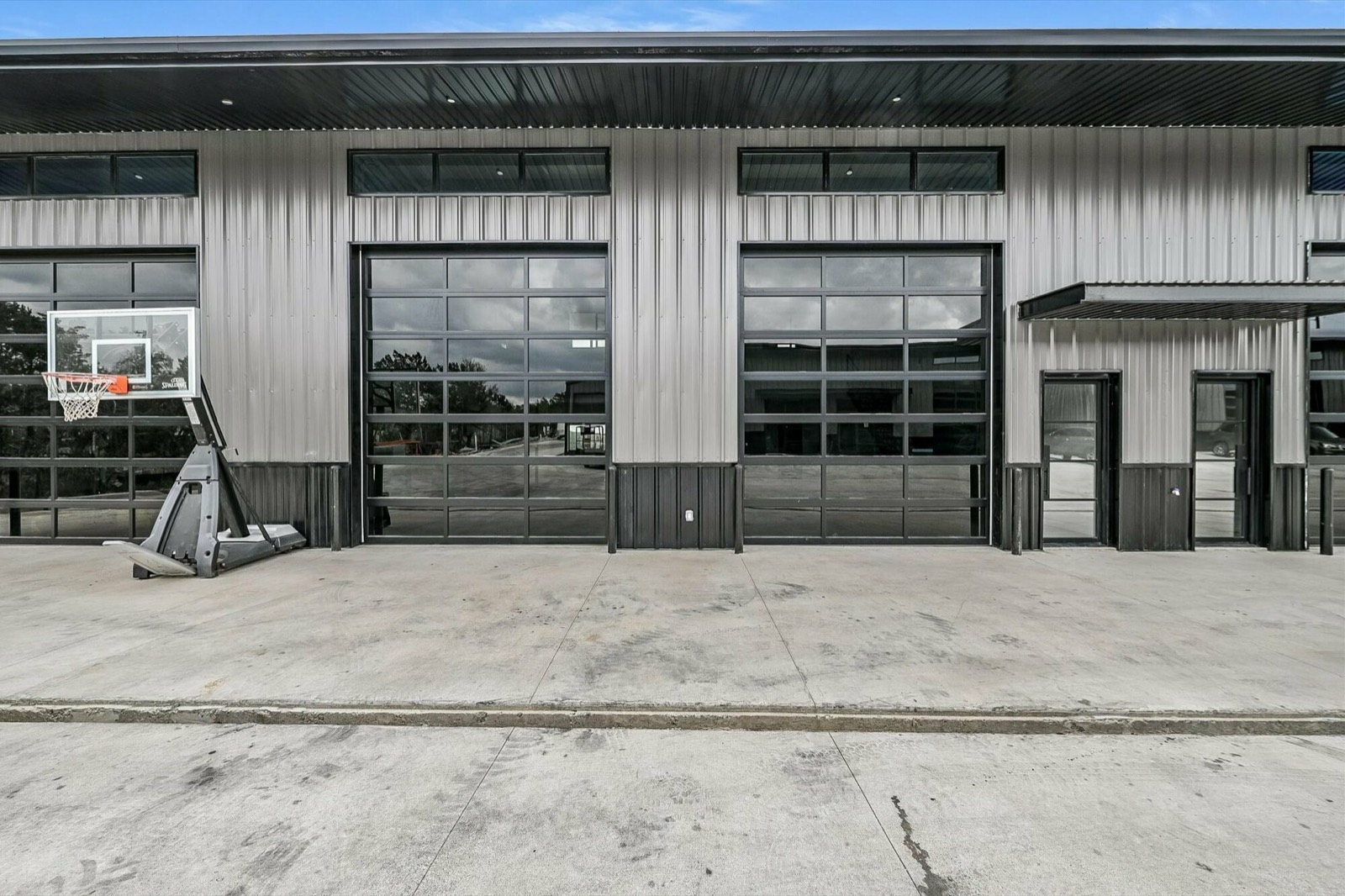 Glass overhead-door storefronts on metal flex buildings