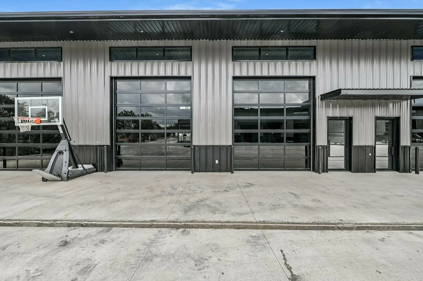 Glass overhead-door storefronts on metal flex buildings