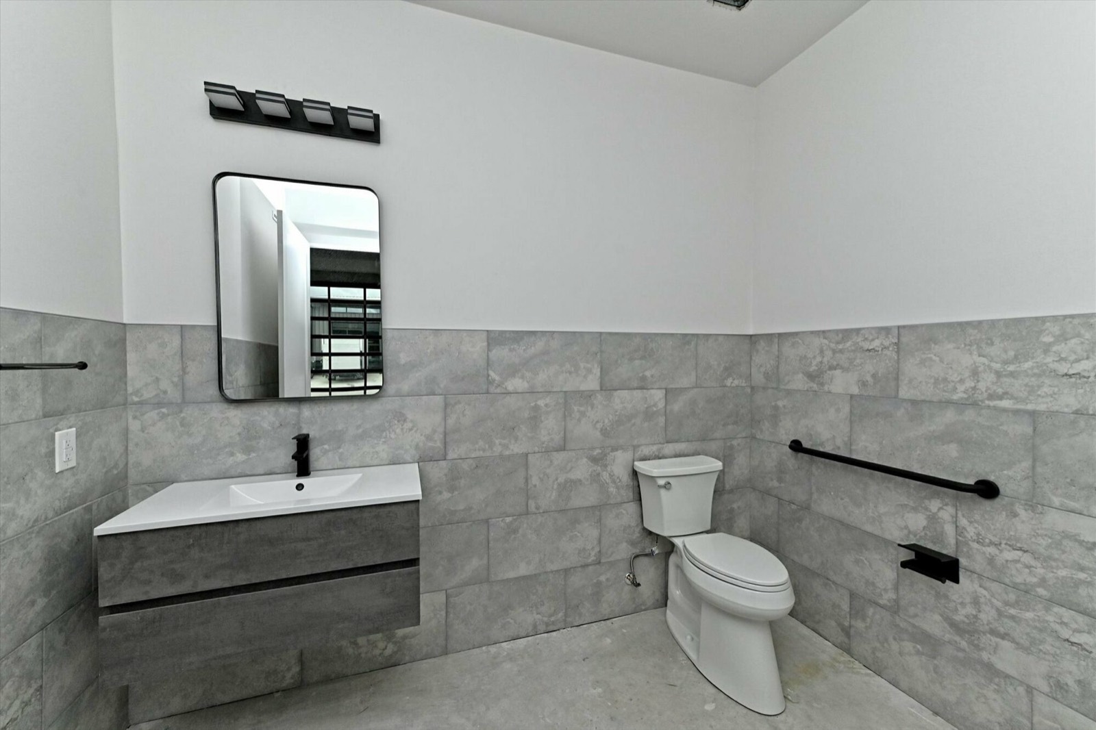 Finished tiled bathroom with modern fixtures