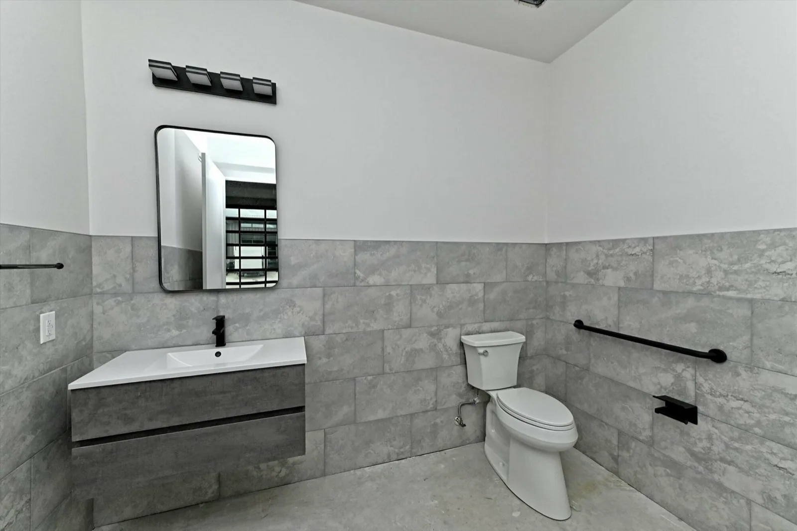 Finished tiled bathroom with modern fixtures